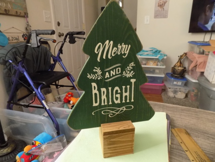 Wooden cut out tree on a wood block base 12 1/2 tall Says Merry & Bright