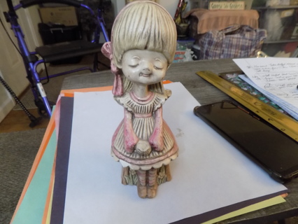 7 inch ceramic little girl sitting in chair in pretty pink dress, white apron long blonde hair