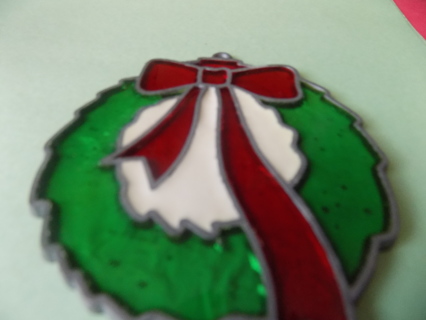 3 1/2 inch stained glass green wreath ornament with a red bow