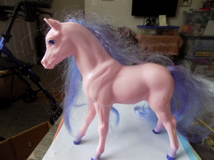 8 inch tall hard pink plastic horse with purple mane and tail comeable
