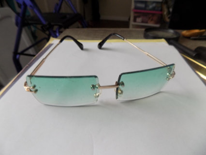 Blue rectangle shape lens glasses tinted on goldtone frame