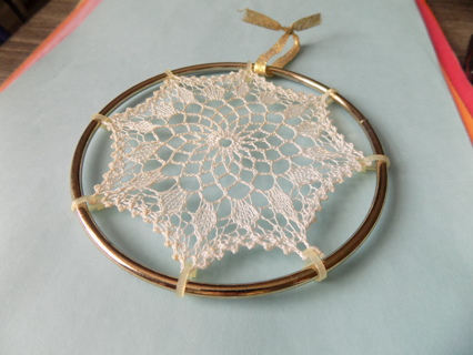 Beautiful hand crocheted doily stretched out & stitched inside 4 1/2 in goldtone ring ornament