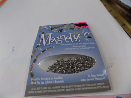 NIP Magnetized small round silvertone beads with metal balls around them