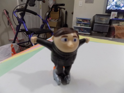 Mc|Donalds toy Gru on rocket skates from movie Rise of Gru