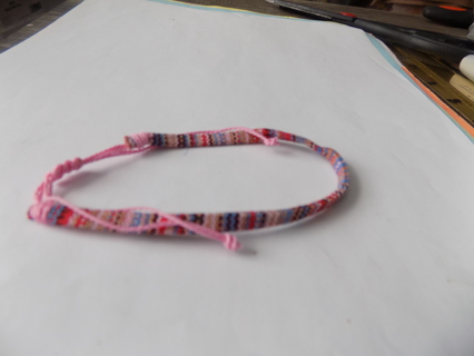 Bracelet woven thread mostly pink and blue adjustable