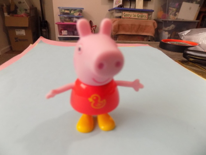 Peppa Pig in red dress with a yellow duck on it 2 1/2 inch poseable