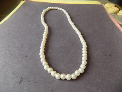 Necklace string of white pearl beads on stretchy cord