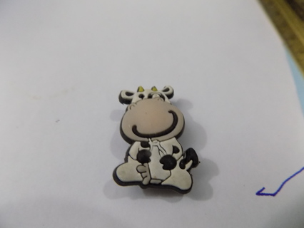 Croc shoe charm cow in sitting up pose