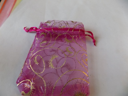 Purple organdy jewelry drawstring bag with swirls in gold