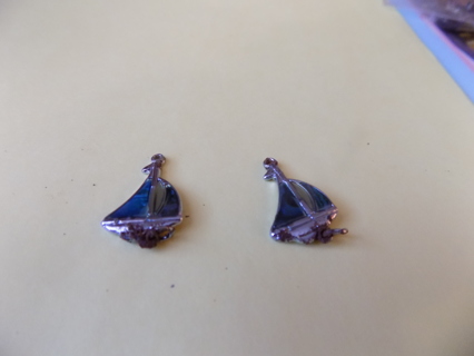 Pair of silvertone sailboat charms with abalone shell on it great for earrings