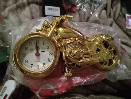 Gold motorcycle clock new in plastic