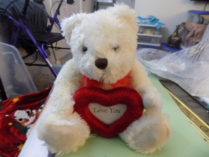 White Sweet Sentiment Bear plush holds heart shape photo frame says Love you