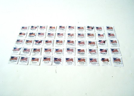 United States Postage Stamps of Flags used still on paper