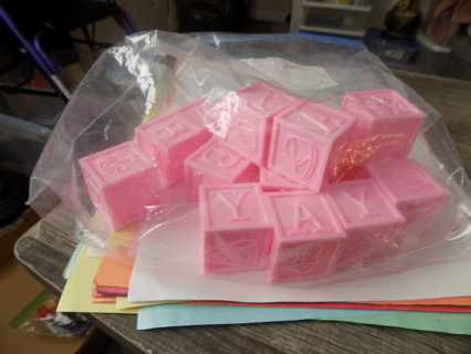 Bag of pink plastic baby building blocks great shower favors