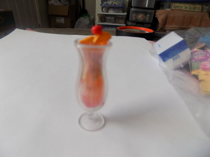 Mini Brands Tropical orange fruit drink in clear hurricane glass orange slice & cherry