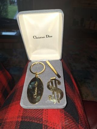 Christian Dior Keychain, tie clip, and money clip set in original box.