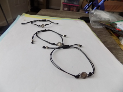 Set of 3 adjustable black cord bracelets with silvertoen round charm
