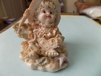 3 inch tall resin little girl playing dressup in mommy's clothes fancy