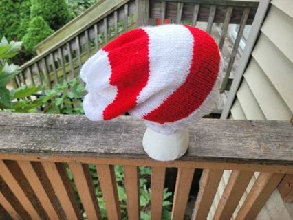 Red and white striped Christmas inspired hand knitted slouchy hat