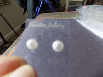 Pair of medium size white pearl bead post earrings