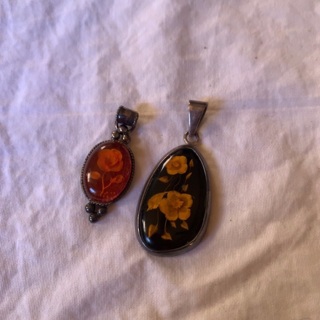 2 Vintage hand carved Amber Pendants