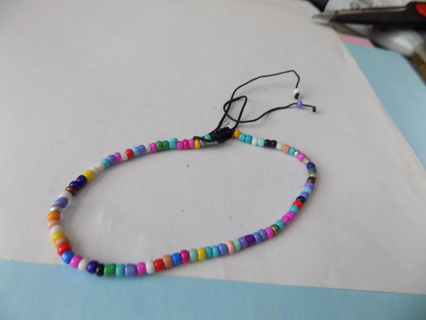 Adjustable Bracelet E beads mostly green pink purple, sky blue
