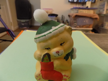Vintage ceramic yellow bear in green hat & scarf holds a stocking 3 inch