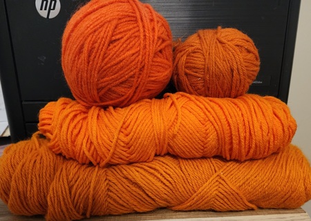 Lot of 4 - Orange Yarns - total weight is 10.1 ozs