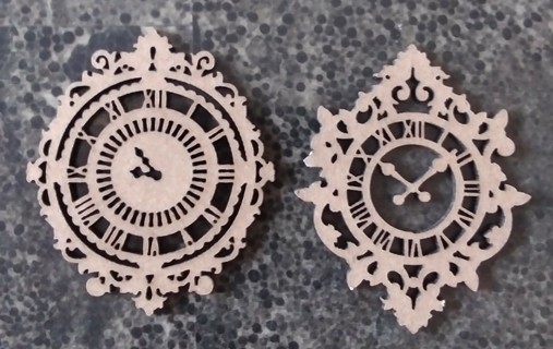 2 small craft clocks, cardboard material.