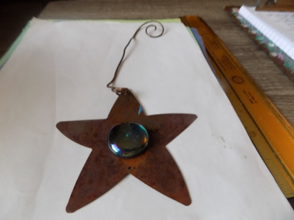 Large copper flat metal star with large blue round stone center 6 inch spiral wire