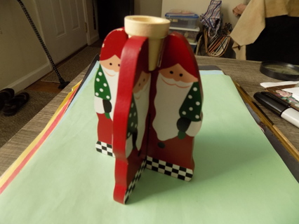 Wooden 4 hand painted Santa's fit together to form taper candle holder checkered pattern