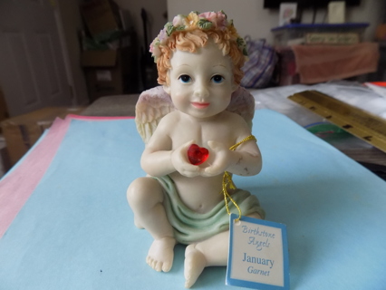 Resin January birthstone angel with genuine garnet.  Tag attached 4 inch