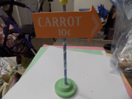 6 1/2 inch wood  carrots 10cents sign on a pole in green base