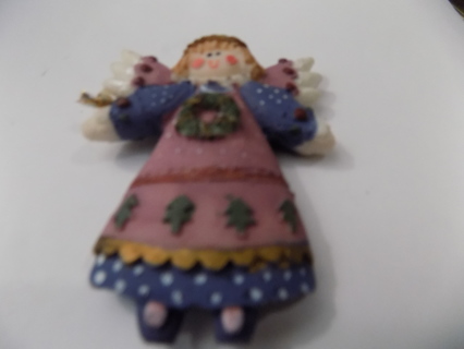 3 inch angel ornametn fabric and purple dress has wreath on her chest