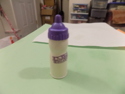 2 1/2 inch Fur Real baby bottle with purple nipple