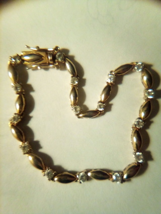 Faux , gold ribbon diamond bracelet 