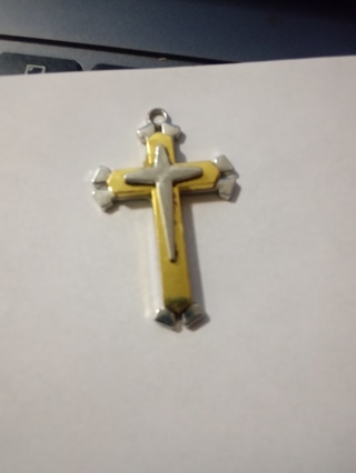 Silver - gold - small silver cross in center over stainless steel 