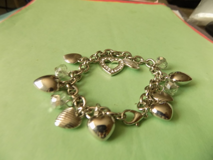 Bracelet silvertone all different hearts, solid, rhinestone coverd, clear faceted beads