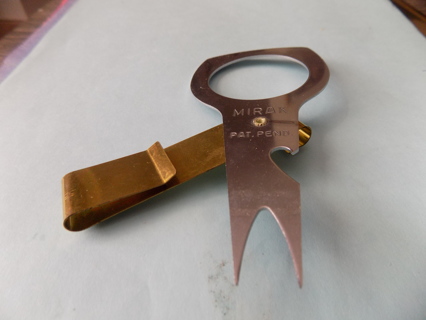 MIRAX metal divet tool on copper clip for golfing