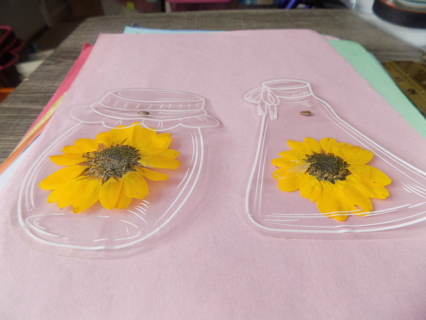 2 sunflowers inside a jar shape outline in white 5 inch tall has seed embedded