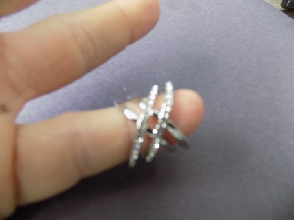 Silvertone 4 intertwined bands ring size 4 2 are covered in rhinestones
