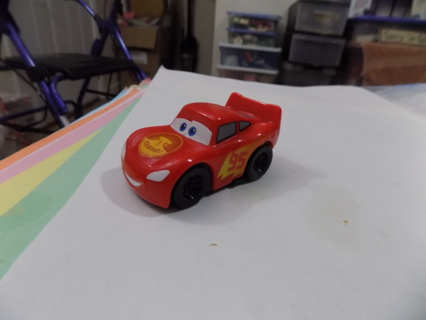 2 1/2 inch red plastic Lightening McQueen pull back action car