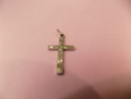 1 1/2 inch silvertone cross charm embossed design on it