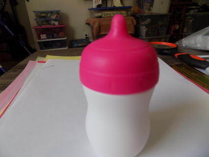 Baby doll bottle 4 inch tall and 2 inch round pink and white