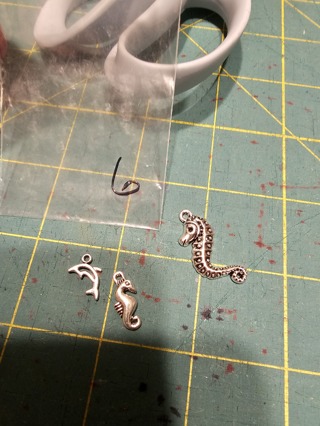 3 small silver charms 