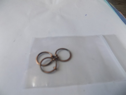 3 copper wire circles attached together charm