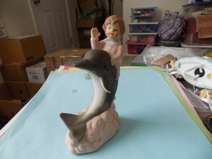 5 inch ceramic baby girl riding a dolphin hand painted