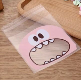 ↗️NEW⭕(3) PINK MONSTER FACE CELLO BAGS!!⭕