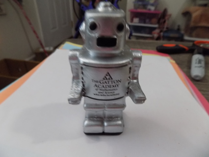 Silver robot squishee 4 inch tall as ad on him