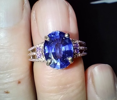 RING STERLING SILVER MARKED AND TESTED WITH A NATURAL BLUE SAPPHIRE THAT HAS BEEN TREATED SIZE 5.25 